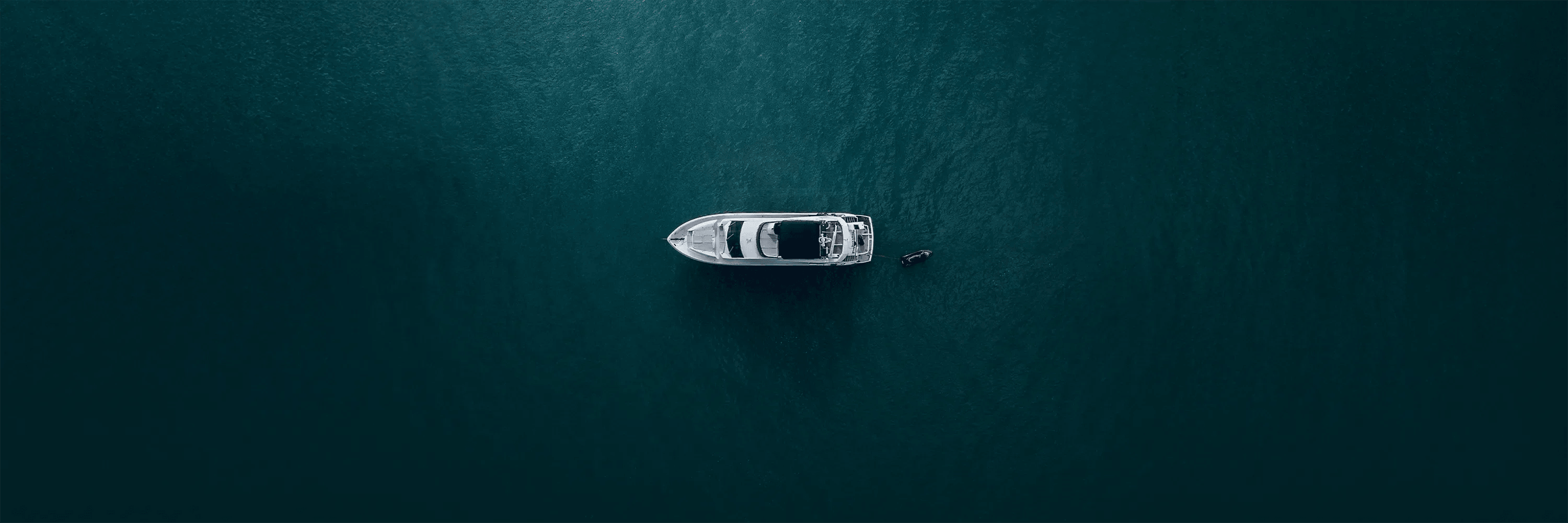 Luxury yacht on open sea symbolizing exclusive crypto lifestyle – Capital Crimes Collection featuring premium blockchain clothing & digital luxury streetwear by CUKIDRIP