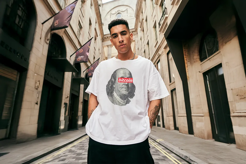 Male model wearing oversized BLND TRST T-Shirt. Style USP on mobile for Crypto Merch Store by CUKIDRIP